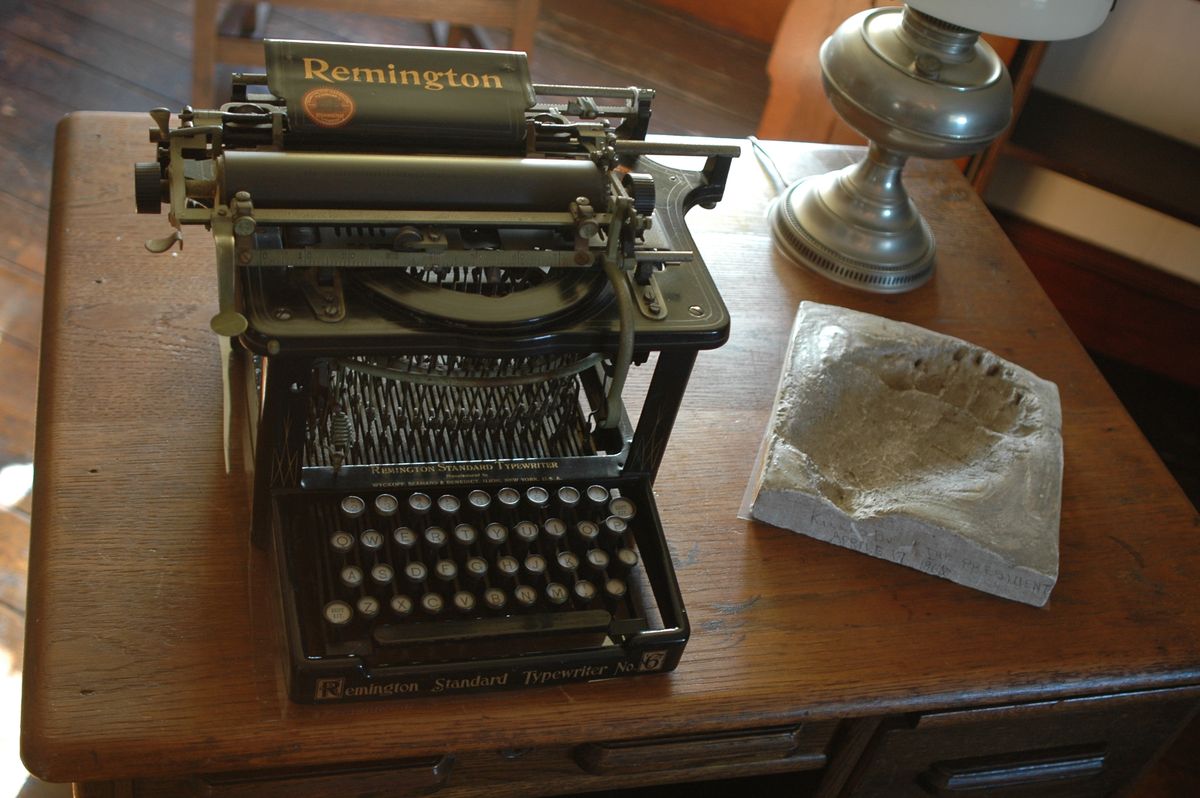 Antique typewriter on a wooden desk
